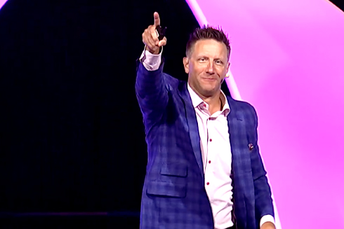 Remarkable Speakers Bureau Randy Fox onstage pointing