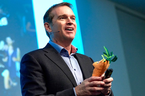 Remarkable Speakers Bureau Adrian Gostick onstage The Carrot Principle