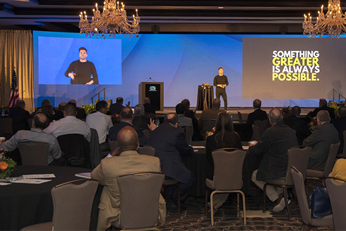 Remarkable! A Speakers Bureau Devin Henderson onstage1 something greater is always possible