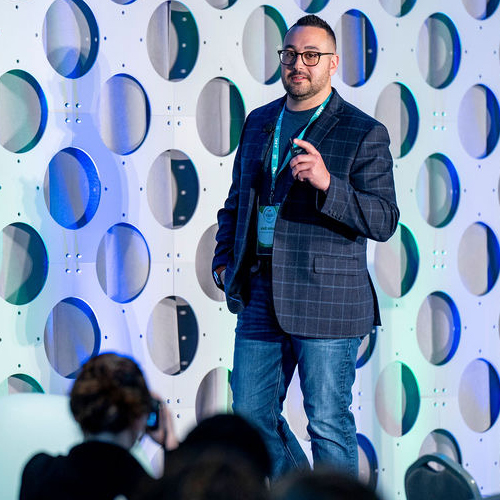 Remarkable Speakers Bureau Dustin Dale onstage featured image