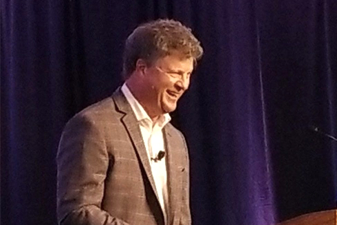 Greg Schwem onstage laughing