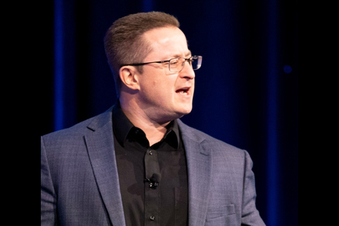 Lee Salz speaking onstage