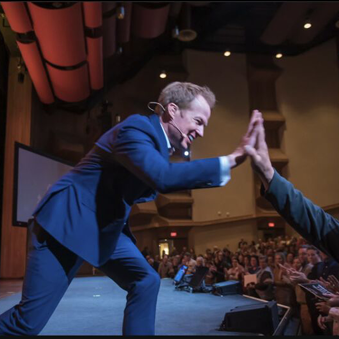 Remarkable! A Speakers Bureau Kenyon Salo with audience high five